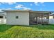 A view of the backyard and screened-in patio at 3005 Crispin Cir, Harmony, FL 34773