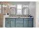 Bathroom features double sinks, granite countertops, and a glass-enclosed shower with tiled walls at 3005 Crispin Cir, Harmony, FL 34773