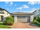 Single-Gathering home with a two-car garage, brick driveway, and well-maintained landscaping at 3005 Crispin Cir, Harmony, FL 34773