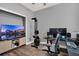 Versatile home office and living room space with dual monitors and exercise equipment at 3005 Crispin Cir, Harmony, FL 34773