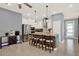 Bright kitchen features stainless steel appliances, granite counters and a wooden-accented island with barstool seating at 3005 Crispin Cir, Harmony, FL 34773