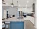 Kitchen featuring stainless steel appliances, a large island with granite countertops, and modern pendant lighting at 3005 Crispin Cir, Harmony, FL 34773