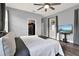 This spacious main bedroom features hardwood floors, walk-in closet, bright windows, and a ceiling fan at 3005 Crispin Cir, Harmony, FL 34773