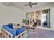 Cozy outdoor patio with stylish seating and sliding glass doors to the living area at 3005 Crispin Cir, Harmony, FL 34773