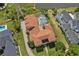 Expansive backyard featuring a screened-in pool and spa, surrounded by mature landscaping at 304 Acadia Ln, Celebration, FL 34747