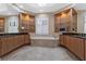 Elegant bathroom with a built-in tub, double vanities, and decorative shelving with glass displays at 304 Acadia Ln, Celebration, FL 34747