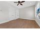 Bedroom with wood floors, ceiling fan, and closet doors at 304 Acadia Ln, Celebration, FL 34747