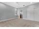 Carpeted bedroom with blue paint, a ceiling fan, closet and bathroom access at 304 Acadia Ln, Celebration, FL 34747