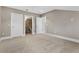 Spacious bedroom with plush carpeting and multiple doors at 304 Acadia Ln, Celebration, FL 34747