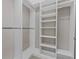 Organized walk-in closet with built-in shelving and ample storage at 304 Acadia Ln, Celebration, FL 34747