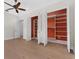 Walk-in closet featuring open shelving and wood flooring at 304 Acadia Ln, Celebration, FL 34747