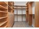 Organized walk-in closet with custom wooden shelving and drawers for maximum storage and convenience at 304 Acadia Ln, Celebration, FL 34747