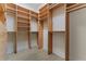 Well-designed walk-in closet featuring custom built-in shelving and ample storage space at 304 Acadia Ln, Celebration, FL 34747