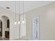 Dining area featuring pendant lighting, shuttered windows, and easy access to the kitchen area at 304 Acadia Ln, Celebration, FL 34747