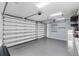 Spacious three-car garage featuring sealed flooring, overhead lighting, and ample open space at 304 Acadia Ln, Celebration, FL 34747