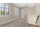 Hallway with carpet, windows, and stairs at 304 Acadia Ln, Celebration, FL 34747