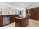 Open-concept kitchen with island and stainless steel appliances at 304 Acadia Ln, Celebration, FL 34747