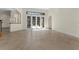 Spacious living room with tile flooring and large glass doors, letting in plenty of natural light at 304 Acadia Ln, Celebration, FL 34747