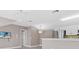 Cozy living room featuring a modern flat screen television and stainless steel refrigerator at 304 Acadia Ln, Celebration, FL 34747