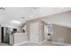 Bright living room showcasing a stainless steel refrigerator and modern ceiling fan at 304 Acadia Ln, Celebration, FL 34747