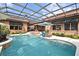Relaxing pool and spa features tile trim, lounge chairs, and ample outdoor seating and patio space at 304 Acadia Ln, Celebration, FL 34747
