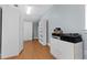 Functional storage room with hardwood floors and plenty of cabinet space at 304 Acadia Ln, Celebration, FL 34747