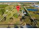 Aerial view of large property with home, detached garage, pond, and ample land at 3161 Appaloosa Ct, Kissimmee, FL 34746