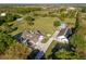 Large property with home, detached garage, pastures, and mature trees at 3161 Appaloosa Ct, Kissimmee, FL 34746