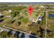 Aerial view of expansive property featuring home, detached garage, pastures, and pond at 3161 Appaloosa Ct, Kissimmee, FL 34746