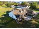 Scenic aerial view of a home with lush lawns, mature trees and detached garage at 3161 Appaloosa Ct, Kissimmee, FL 34746