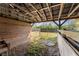 Inside a barn featuring a wooden fence, dirt floor, and ample space at 3161 Appaloosa Ct, Kissimmee, FL 34746