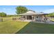 Barn featuring a metal roof and open-air design, perfect for outdoor activities at 3161 Appaloosa Ct, Kissimmee, FL 34746