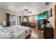 Bright bedroom with large windows, a ceiling fan, and a flat screen television at 3161 Appaloosa Ct, Kissimmee, FL 34746