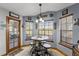Cozy breakfast nook featuring large windows and a bistro-style table set at 3161 Appaloosa Ct, Kissimmee, FL 34746