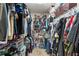 Walk-in closet with plenty of storage space, shelving, and hanging racks at 3161 Appaloosa Ct, Kissimmee, FL 34746