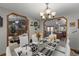 Dining area with modern chandelier, adjacent to open living spaces at 3161 Appaloosa Ct, Kissimmee, FL 34746