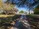Long driveway leads to a charming home, with beautiful lawn and multiple car parking at 3161 Appaloosa Ct, Kissimmee, FL 34746