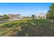 Sprawling lawn between a large brick and white home, featuring a multi-car garage at 3161 Appaloosa Ct, Kissimmee, FL 34746