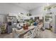 Open kitchen with an island, barstool seating, and white cabinetry at 3161 Appaloosa Ct, Kissimmee, FL 34746