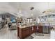 Open-concept kitchen and living area featuring modern appliances and tile flooring at 3161 Appaloosa Ct, Kissimmee, FL 34746