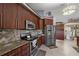 Well-equipped kitchen with stainless steel appliances and granite countertops at 3161 Appaloosa Ct, Kissimmee, FL 34746
