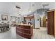 Open kitchen featuring custom cabinets, granite countertops, and breakfast bar at 3161 Appaloosa Ct, Kissimmee, FL 34746