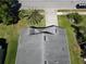 This aerial view shows the home's roof, landscaping, and proximity to the street at 3874 Blackberry Cir, St Cloud, FL 34769