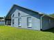 An exterior shot of the back of the house shows the clean stucco and green yard at 3874 Blackberry Cir, St Cloud, FL 34769
