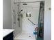 Bathroom featuring a standup shower with safety bars and built in storage niche at 3874 Blackberry Cir, St Cloud, FL 34769