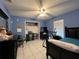 Bedroom featuring tile floors, a ceiling fan, closet, and a neatly made bed, creating a comfortable space at 3874 Blackberry Cir, St Cloud, FL 34769