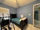 This bedroom features a single bed, and tiled floors, and could be used for guests or Gathering at 3874 Blackberry Cir, St Cloud, FL 34769