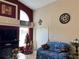 A cozy living room view features a festive Christmas tree and comfortable seating at 3874 Blackberry Cir, St Cloud, FL 34769