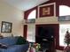 Spacious living room with high ceilings, fireplace, and large windows at 3874 Blackberry Cir, St Cloud, FL 34769