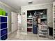 Large walk in closet with shelving and storage bins provides plenty of space for organization at 3874 Blackberry Cir, St Cloud, FL 34769